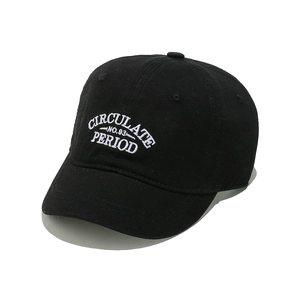 Detailed view of white letter embroidery on a premium black cotton baseball cap