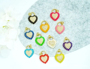 Detail of colorful enamel heart pendants with 18K gold plating and micro-pave crystals