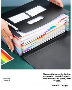 Macro detail of black expanding file folder showing multiple layers and side pen slot holder