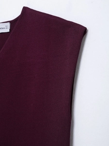 Detailed view of the fine knit texture and V-neckline of this deep purple vest top