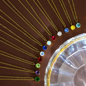 Golden birthstone necklace with colorful round zircon pendants in radial layout