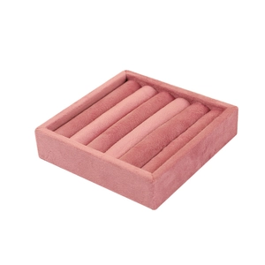 Pink velvet jewelry display tray with six ring slots for elegant shop presentation