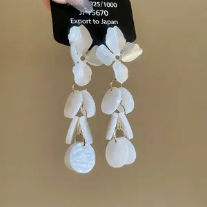 Elegant white floral acrylic tassel earrings with S925 silver needles for a vintage look