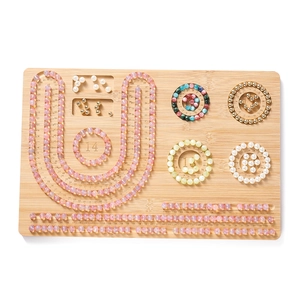 Top view of bamboo beading design board with precise scale markings and sorting grooves