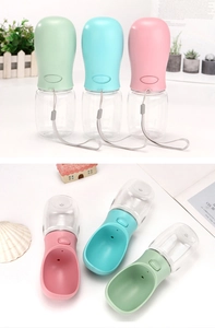 Detail of portable pet water bottle showing macaron colors and leak-proof button system