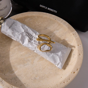 Detail of baroque pearl on 18K gold stainless steel ring with asymmetric design