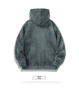 Detail view of double-sided soft polar fleece texture on dark gray hooded sweatshirt
