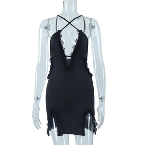 Detail of the black bodycon dress with lace trim and criss-cross straps