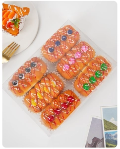 Set of 6 realistic PU foam miniature cupcakes with colorful fruit toppings in a box