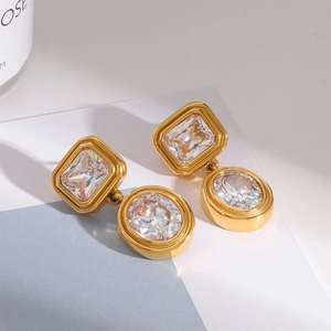 Elegant gold earrings with clear emerald-cut and oval zircon crystals for women