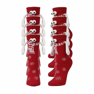 Red Christmas socks with cute 3D eyes and magnetic hands holding snowflake patterns