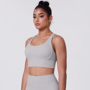 Close-up of light grey high-elastic yoga set with wide strap bra and high-waist leggings