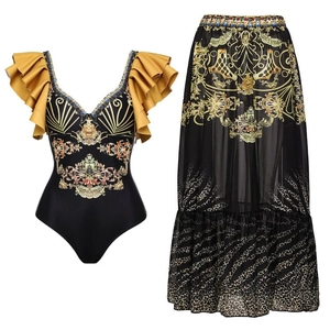 Detail of ruffle shoulder sleeves and baroque gold print on a black one-piece swimsuit
