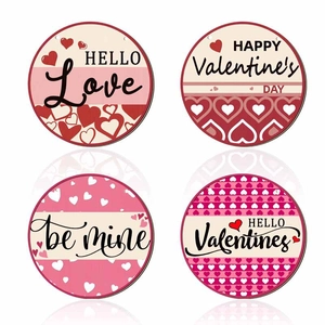 Set of four wooden Valentine's Day ornaments with heart motifs in pink and red