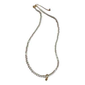 Elegant white faux pearl necklace with a gold spherical pendant and adjustable metal clasp