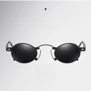 Detail of black punk oval metal sunglasses with unique geometric hollowed temple design