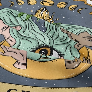 Detail of mystical Gemini tarot tapestry with zodiac symbols and lush botanical artwork