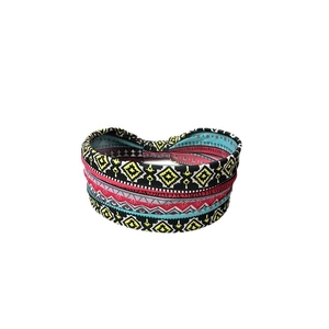 Bohemian style printed wide headband with geometric patterns and cross knot design