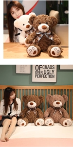Detailed plush teddy bear feet featuring red heart embroidery and cute plaid bow ties