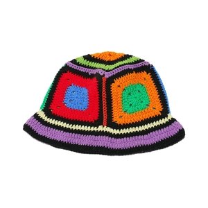 Detail of handmade crochet bucket hat featuring colorful granny square floral patchwork