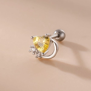 Macro shot of heart-shaped yellow zircon stud earring with stainless steel screw back