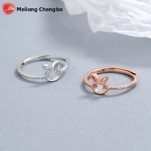 Detail of S925 silver adjustable bunny rings in silver and rose gold with micro-pave crystals