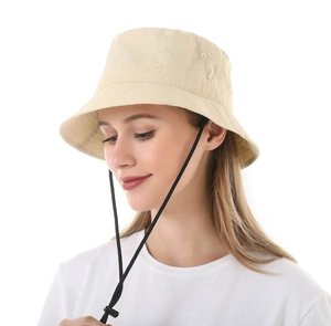 Detail of beige sun hat with adjustable windproof drawstring and waterproof fabric