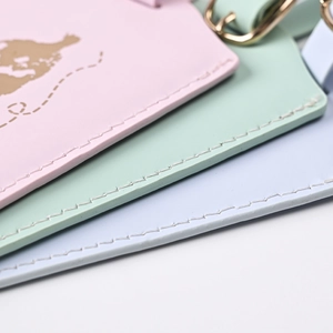 Detail of multi-color PU leather luggage tags with gold stamping and fine stitching