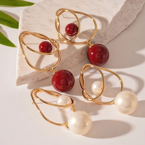 Vintage geometric gold wire-wrapped earrings with red acrylic and white pearl beads