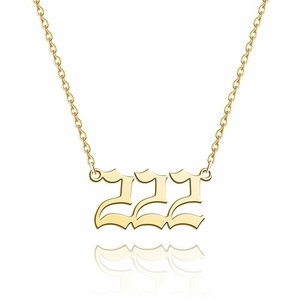 Macro view of 14K gold plated stainless steel number 222 pendant with fine link chain