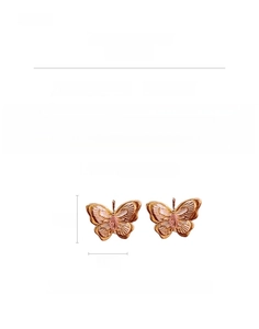 Detail view of rose gold butterfly earrings with zircon stones and silver needles