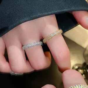 Gold plated twisted open ring with sparkling cubic zirconia stones for women