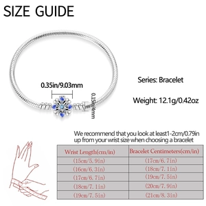 Size guide for silver charm bracelet with blue snowflake bead and wrist measurement chart