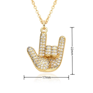 Detailed view of hip hop gold pendant with dimensions 22mm by 17mm and zircon inlay