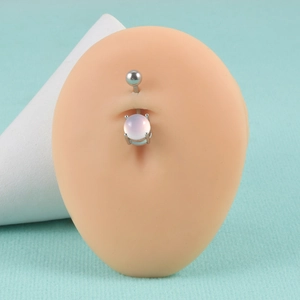 Detail of 14G stainless steel belly ring with white opal stone on navel model