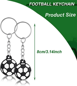 Detail view of 8cm football keychain with size measurement on green and white background