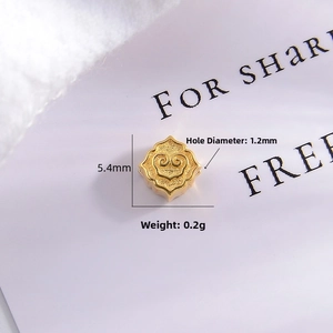 Macro shot of 5.4mm gold S925 silver Ruyi charm with 1.2mm hole for DIY jewelry making