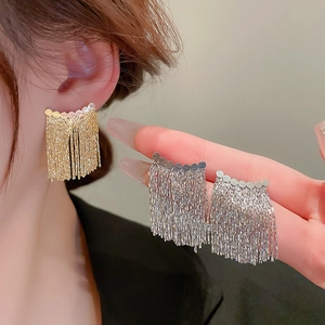 Elegant geometric gold and silver tassel earrings with sequin details and metal chains