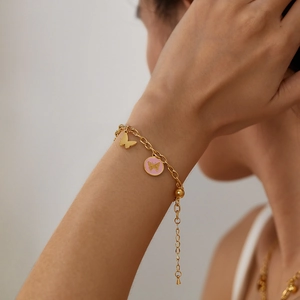 Golden stainless steel chain bracelet with 3D butterfly and pink enamel charms