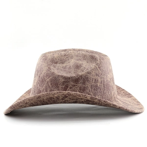 Detailed view of the vintage distressed crackle texture on the brown cowboy hat's surface