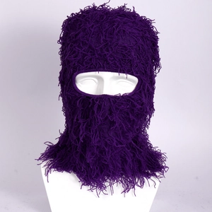 Detailed macro view of purple plush balaclava with long faux fur texture and full face cover