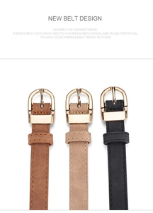 Close-up of three PU leather belts in brown, beige, and black with gold metal buckles