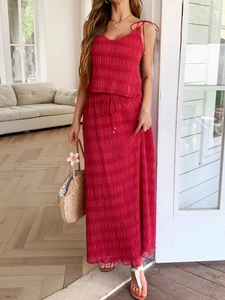 Red two-piece vacation set for women with pleated camisole top and long flowy skirt