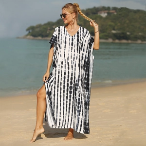 Detail of V-neck beach coverup with black and white vertical tie-dye and side slit