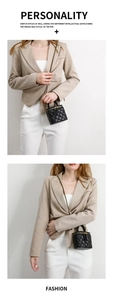 Quilted mini chain bag in black with gold hardware shown on a model for versatile styling