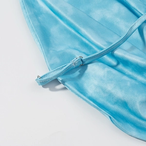Detailed close-up of glossy bright blue fabric and adjustable thin shoulder straps