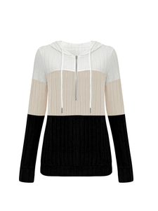 Detail of ribbed knit fabric on long-sleeve hoodie with zipper and color-block design
