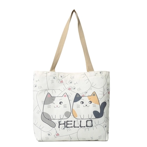 Off-white large canvas tote bag with cute cartoon cat print and sturdy woven handles