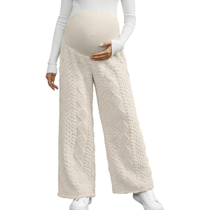 Macro detail of the high waist maternity trousers featuring premium cable knit texture