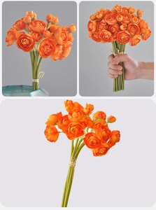 Detailed view of artificial orange buttercup bouquet with silk petals for home decor